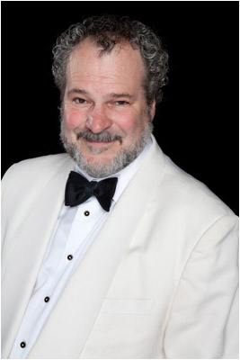 magician Johnny Ace Palmer in white tuxedo photo